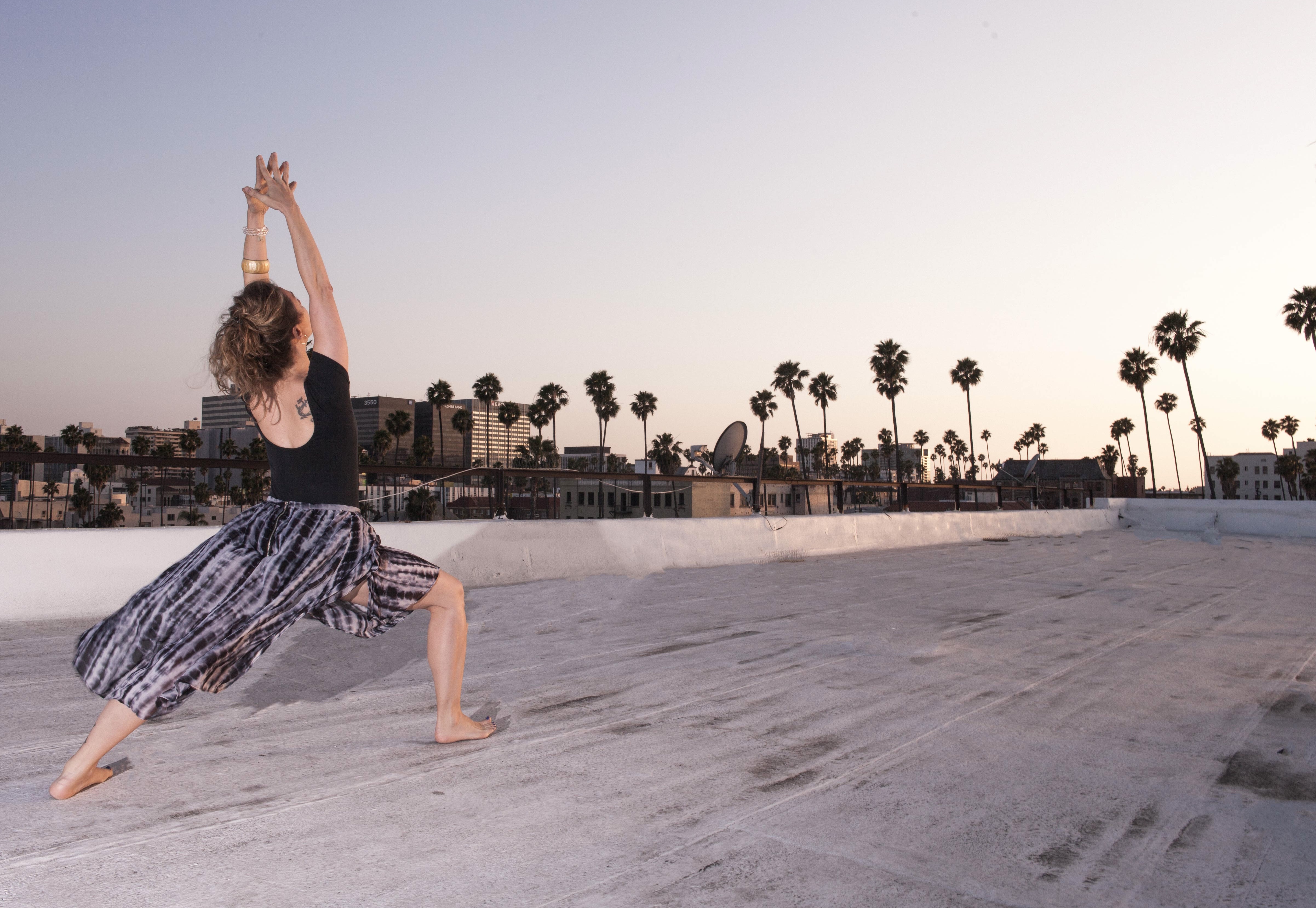 Marah Santos in Warrior I Pose on a Los Angeles Rooftop